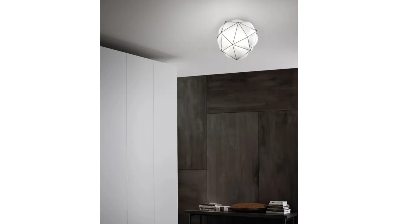 Ceiling lamp Semai in shiny white blown glass inside a dark stainless steel cage by Vistosi.