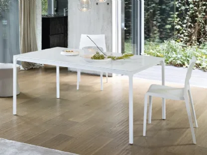 Extendable opaque glass Zen table by Bonaldo.